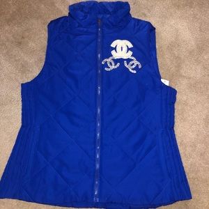 Customized puffer vests and beanies.